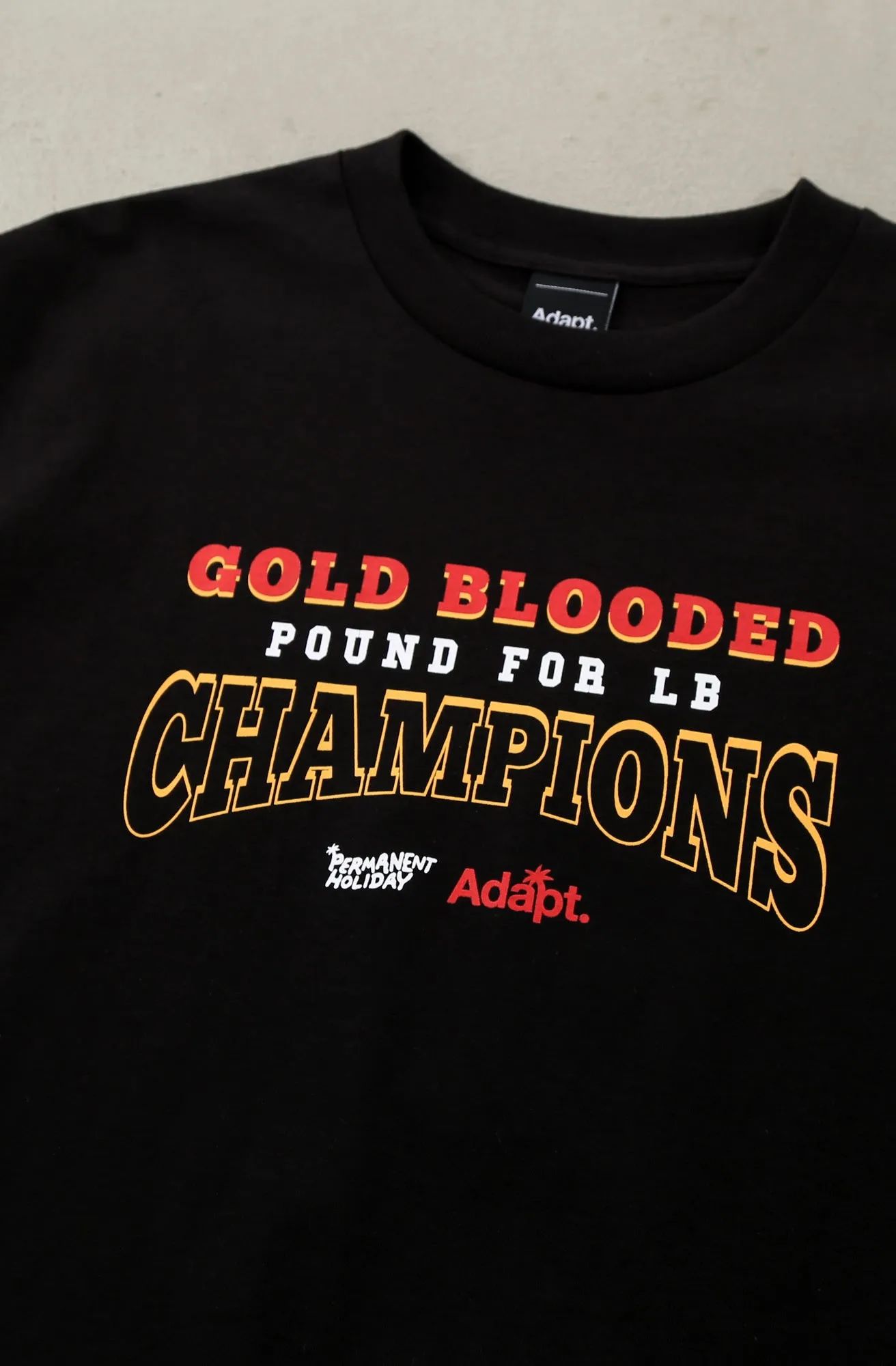 Permanent Holiday X Adapt :: Gold Blooded Holiday (Men's Black Tee)